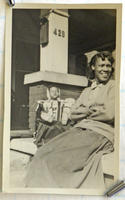 Woman and baby on porch steps