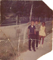 Runa Caldwell, James Pressley and Loretha Foushee in front of a fence