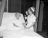 Nurse and child at St. Leo's Hospital