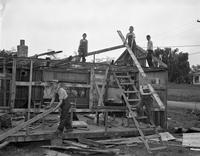 Boys Working on a House