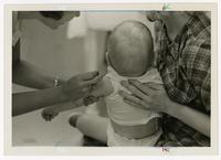 Infant receiving checkup