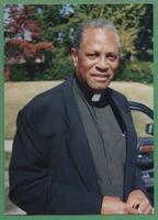 Photo of Reverend in collar outdoors