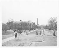 Students walking across College Avenue