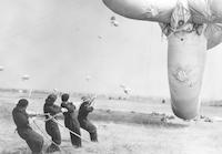 Royal Air Force servicewomen pull balloon