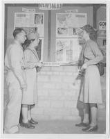 Evelyn E. Horton at WWII news bulletin board