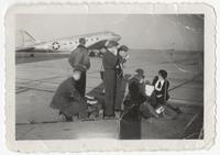 Flight nurse students and Air Force medical technicians on tarmac
