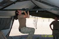 Female airman doing a pull-up