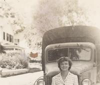 Doris Dicken Wilson in front of military vehicle