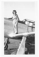 Violet Thurn Cowden on wing of plane