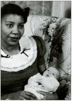 Josephine Watkins holding a baby
