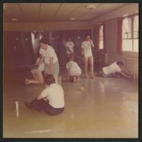 Terri Ann Dellapina and others cleaning the floor