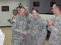 Photograph of Melissa Culbeth with Army Chief of chaplains on Thanksgiving Day in Baghdad
