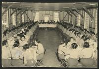 Photo post card depicting African American WAACs or WACs in a mess hall