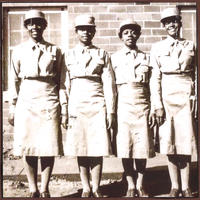 Four Enlisted WAACS Standing in Front of the Fort Des Moines Mess Hall, 1942