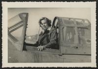 Margery Moore Holben in the cockpit of an airplane, 1944