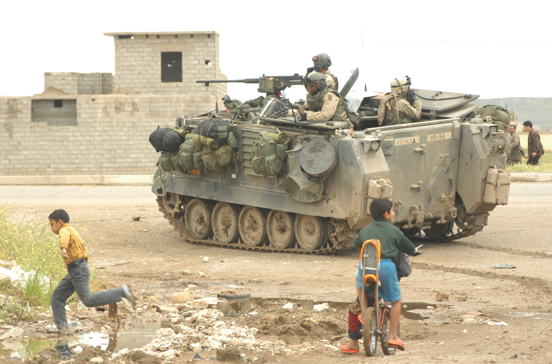 A M113 Armored Personnel Carrier patrols in Iraq, circa 2003