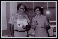 Photograph of Nancy Ashley Myers receiving a Certificate of Membership in the American Society of Military Comptrollers