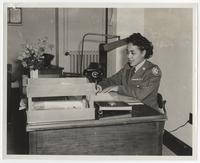Inez Stroud at desk