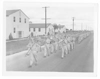 WAACs parade past barracks