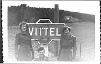 WACs beside a road sign for Vittel
