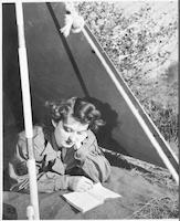 Emma Dale Love reading in tent