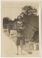 Margaret Greene in front of tents