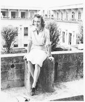 Beverly Sheppe sitting on a wall