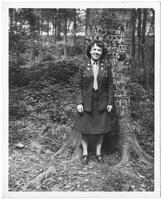 June Neely Baker beside a tree