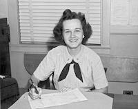 Nell Smith Lutz at desk