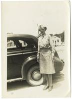 Florence S. Weil beside a car